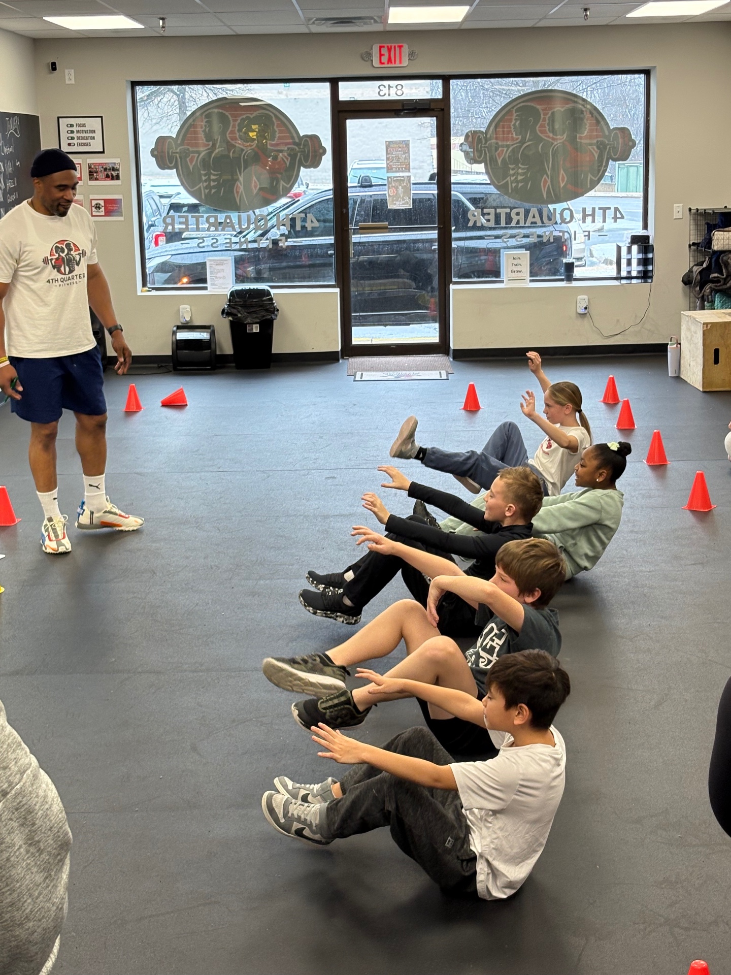 Coach C leading youth fitness drills
